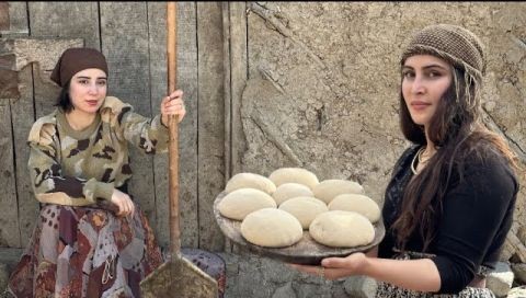 ⁣Using a village oven to cook kebab rolls and bread!