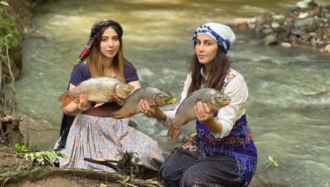 ⁣Steamed carp fish flavored with organic pomegranates and spices in the beautiful village