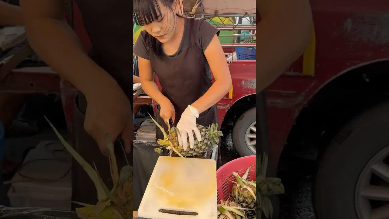 So Juicy, So Sweet! Thai Girl Cutting Pineapple in Thailand